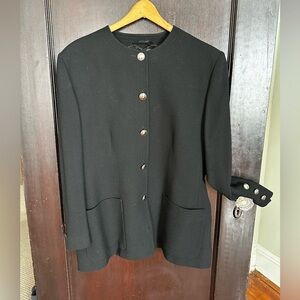 “Jaeger” pure New Wool skirt suit in black from the 1970’s with padded shoulders